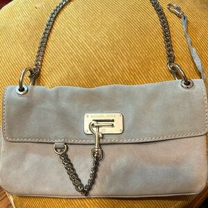 Micheal Kors  lt blue suede leather purse with silver chain handle 6”x11”.